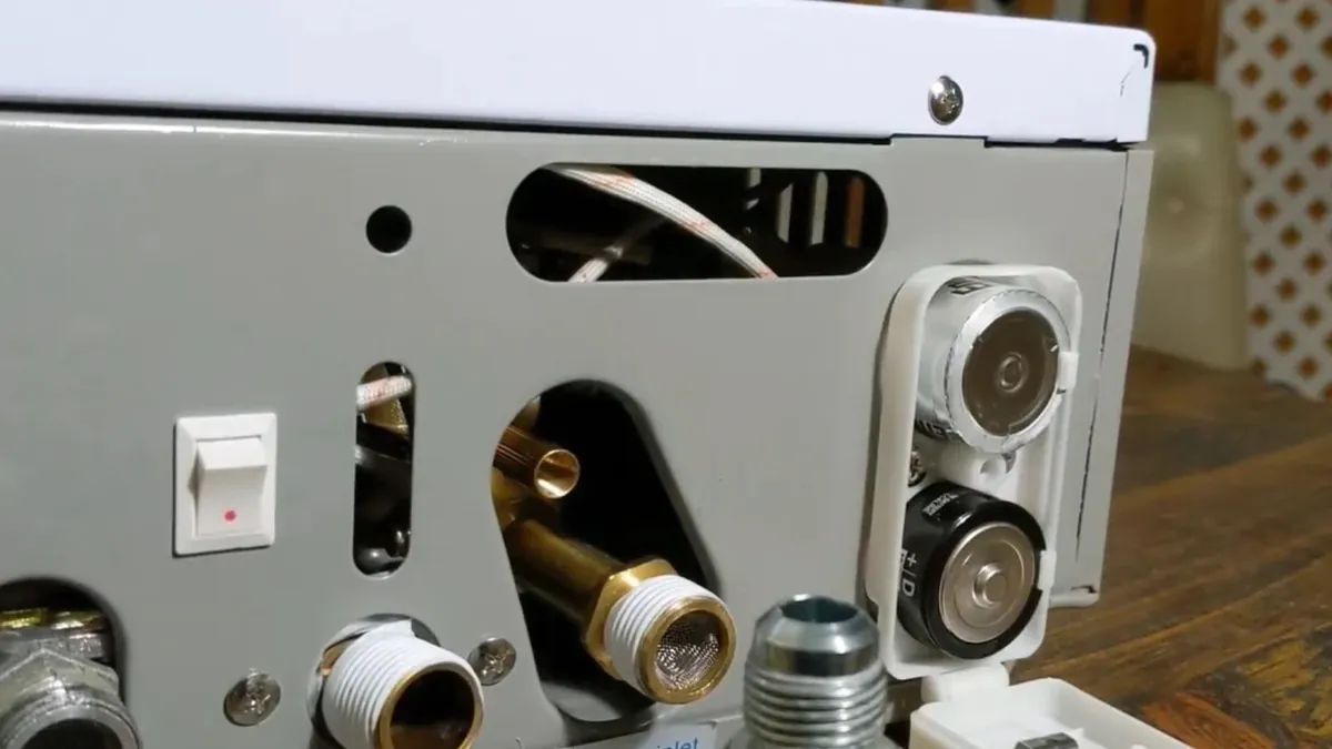 Close view of water and gas connections on a tankless water heater